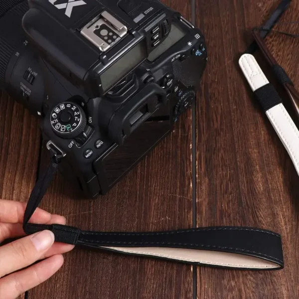 4be73aa536eb4ad39a9f603433611a0b-goods.webp Faux Leather Wristband Camera Strap