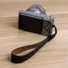 59be63351d8d437aa5f2f93433f0edfb-goods.webp Faux Leather Wristband Camera Strap